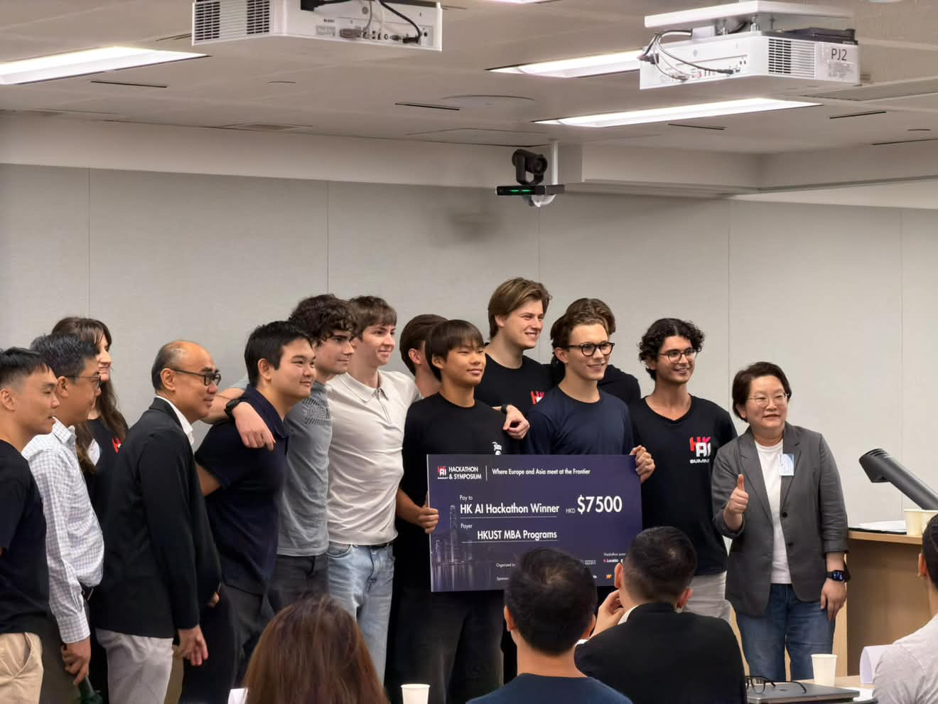 The team on stage at HKUST Business School Central holding the HK$7,500 HK AI Hackathon Winner cheque